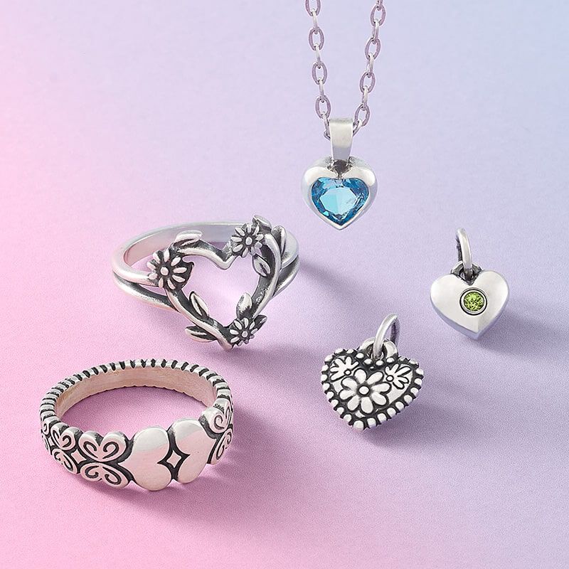 Sterling silver heart-themed jewelry designs.